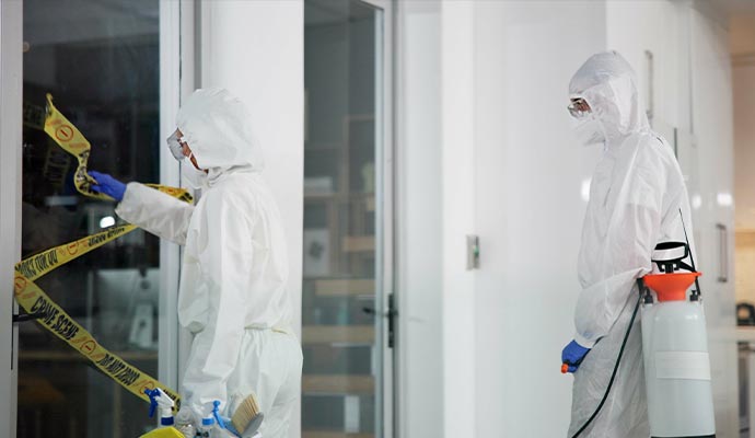 Professionals cleaning up biohazard scene