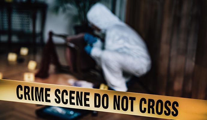 A professional cleaning up a crime scene